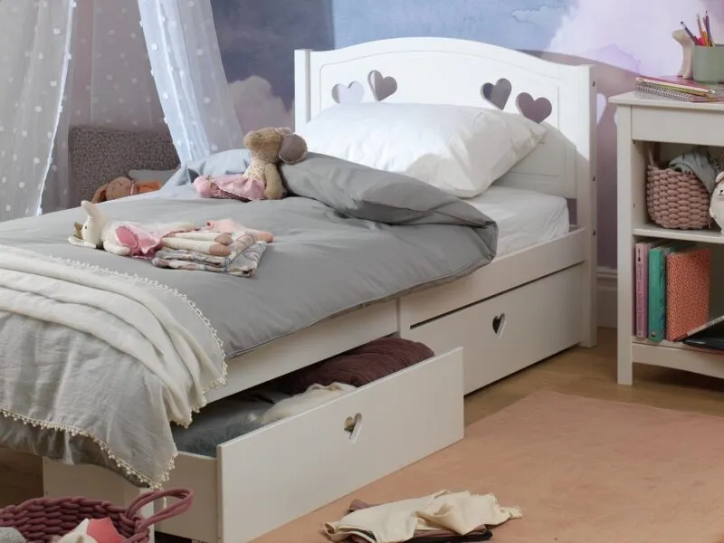 White bed frame with heart cut-out motifs and 2 storage drawers