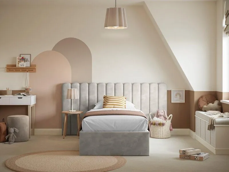 Grey velvet upholstered bed frame with large fluted headboard