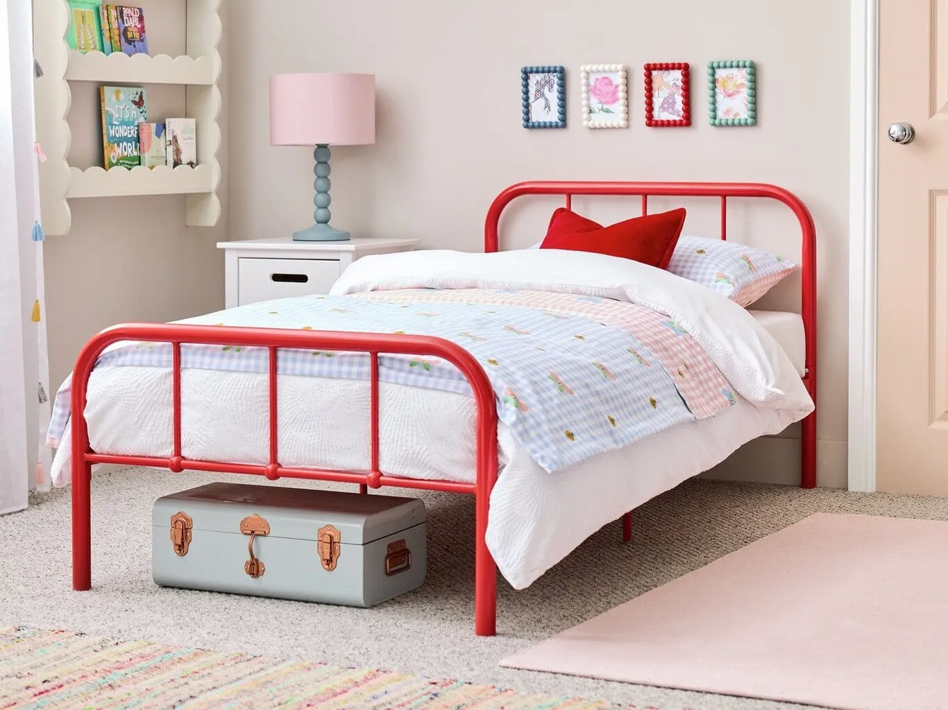 Red-painted single metal bed frame
