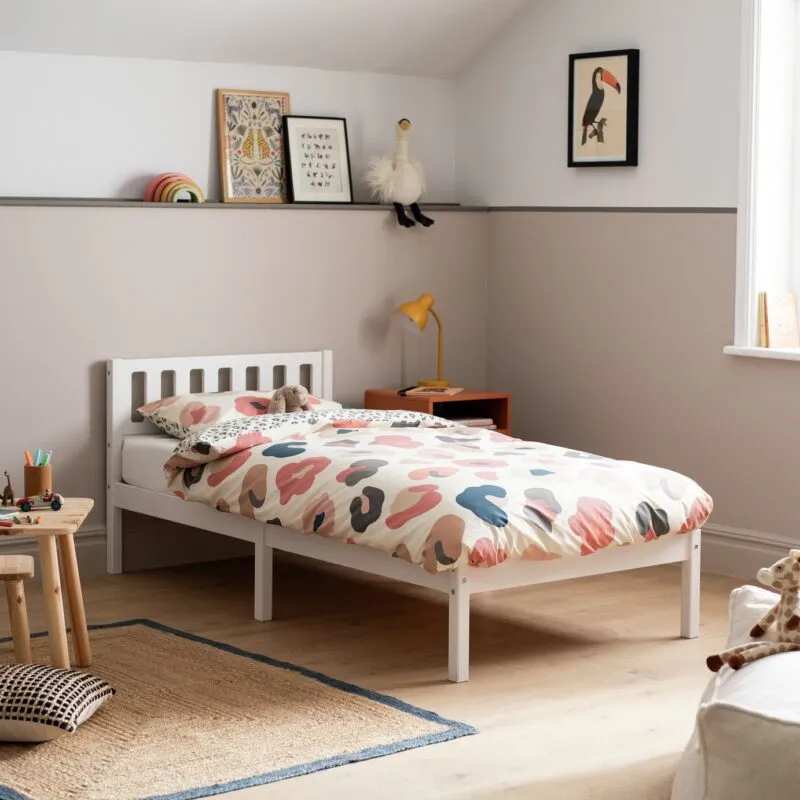 White single bed frame with cut-out slatted headboard
