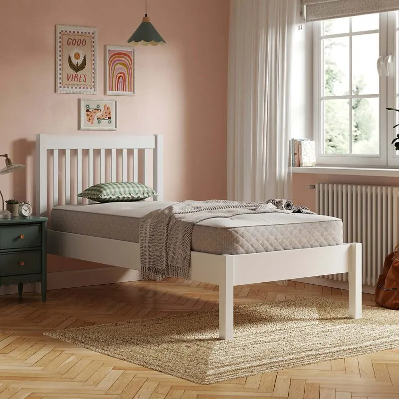 White-painted single bed frame with slatted headboard