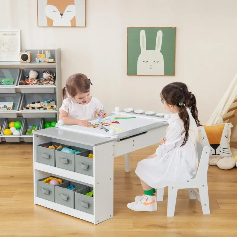 White/grey art table with storage baskets and a pair of matching chairs