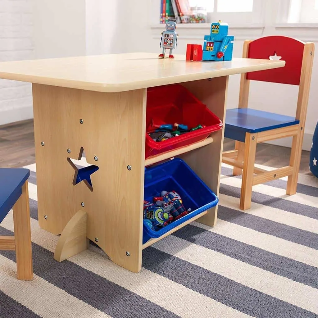Kid’s play table with red and blue storage bins