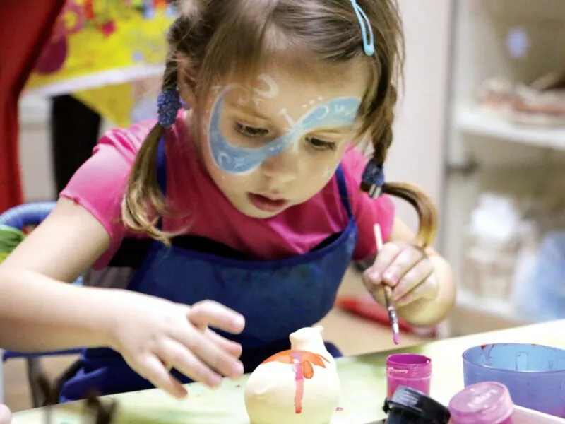 Young girl getting creative with paint