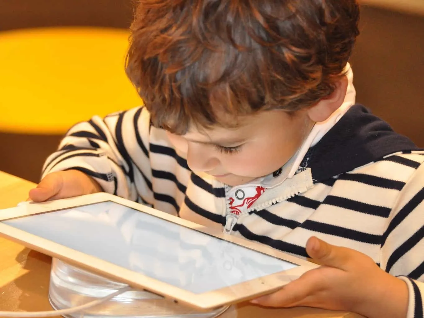 Child playing with a tablet computer